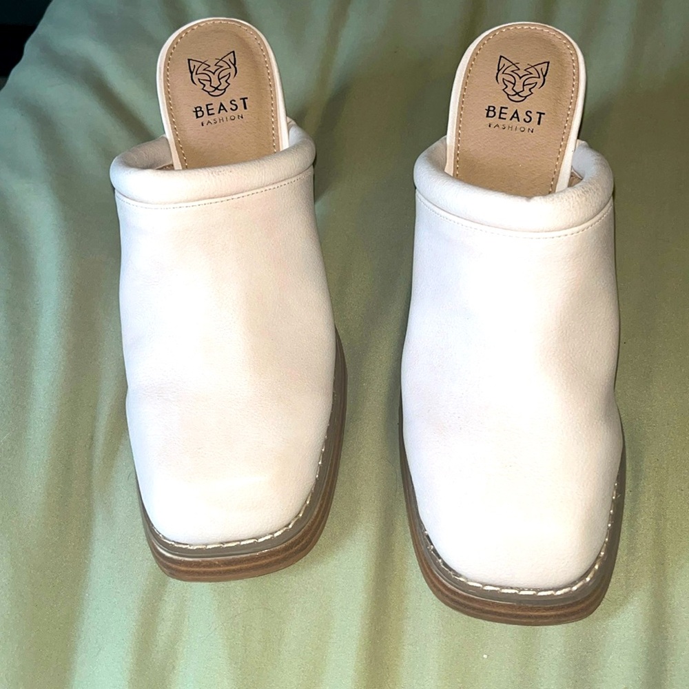 Never worn; small scuffs from moving.